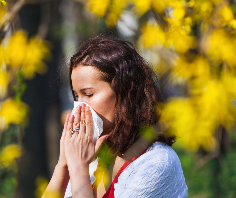 Woman blowing her nose